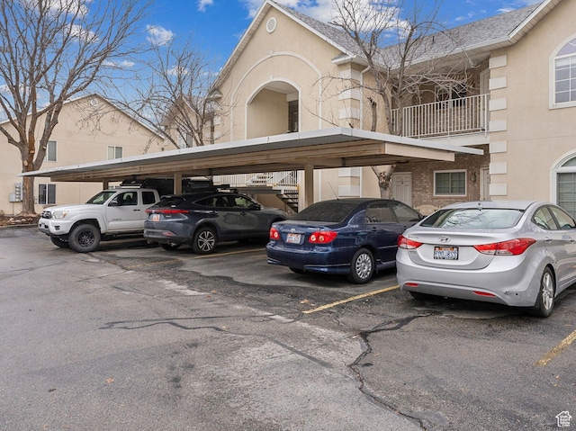 3859 S Mitchell Cv E Unit 203, South Salt Lake, UT 84115 - view of car parking featuring a carport