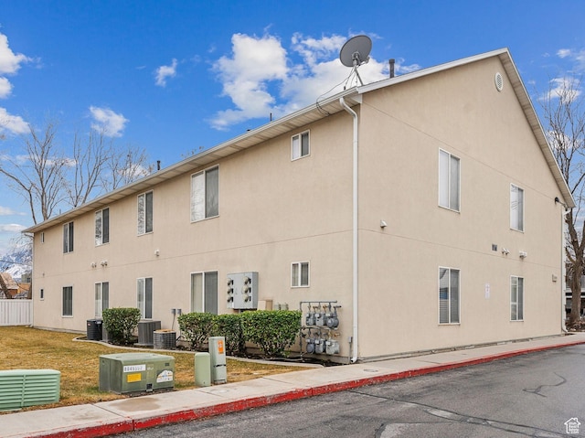 3859 S Mitchell Cv E Unit 203, South Salt Lake, UT 84115 - view of building exterior with central AC