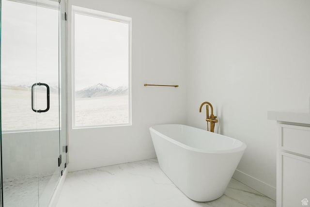 994 W Union Bench Dr S, Mapleton, UT 84664 - bathroom featuring vanity, baseboards, marble finish floor, a soaking tub, and a shower stall