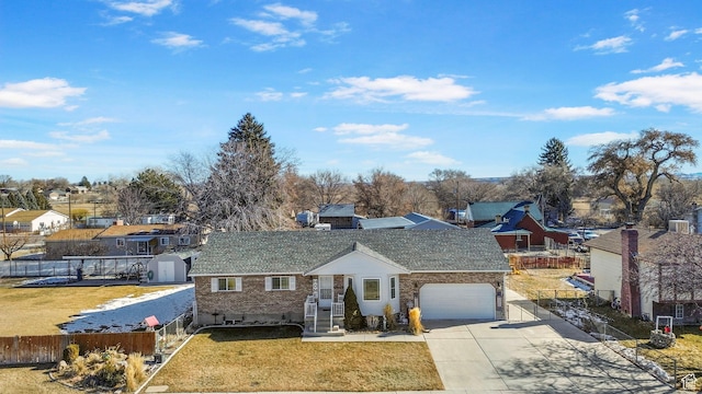 440 W Cottonwood Ln, Ferron, UT 84523 - view of front of home with a garage, a front yard, and a storage unit