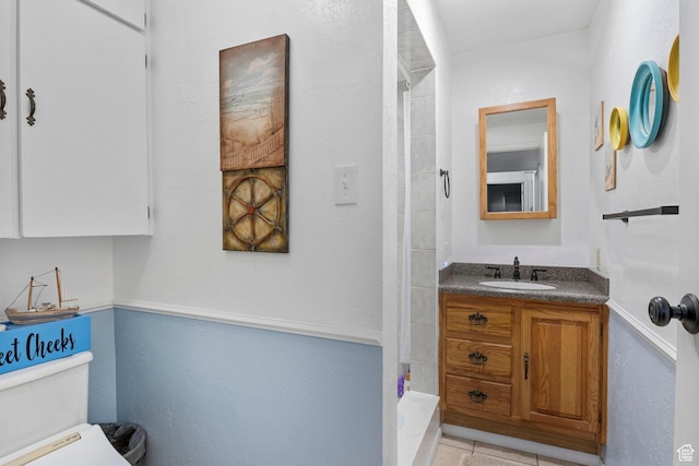 440 W Cottonwood Ln, Ferron, UT 84523 - bathroom featuring vanity, tile patterned flooring, toilet, and walk in shower