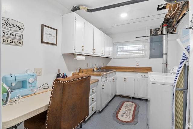 440 W Cottonwood Ln, Ferron, UT 84523 - kitchen featuring sink, washing machine and clothes dryer, electric panel, and white cabinets