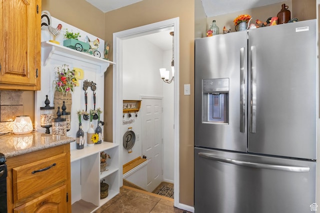 440 W Cottonwood Ln, Ferron, UT 84523 - kitchen with light stone countertops, stainless steel fridge with ice dispenser, and light tile patterned floors