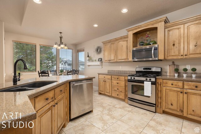 1679 N 4400 W, Plain City, UT 84404 - kitchen with decorative light fixtures, sink, stainless steel appliances, light stone countertops, and an inviting chandelier