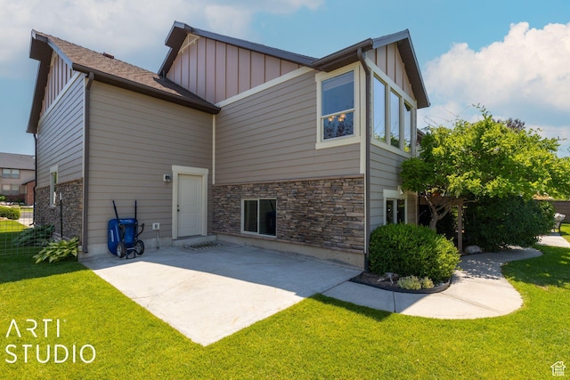 1679 N 4400 W, Plain City, UT 84404 - rear view of house featuring a lawn and a patio