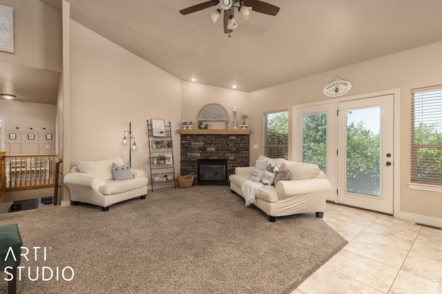 1679 N 4400 W, Plain City, UT 84404 - tiled living room featuring ceiling fan, lofted ceiling, and a stone fireplace