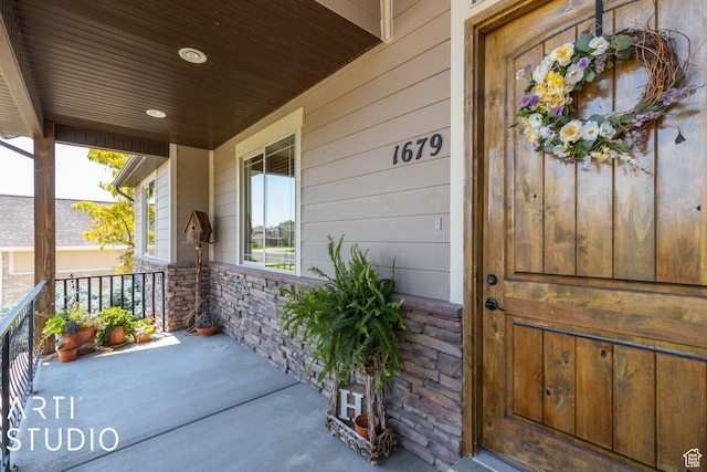 1679 N 4400 W, Plain City, UT 84404 - view of exterior entry with a porch