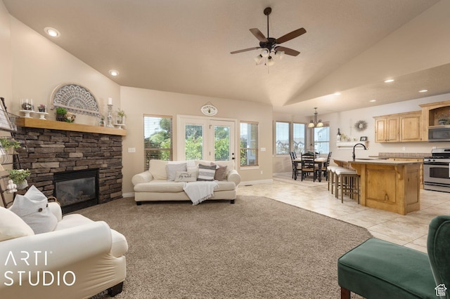 1679 N 4400 W, Plain City, UT 84404 - tiled living room featuring lofted ceiling, a fireplace, sink, and a wealth of natural light