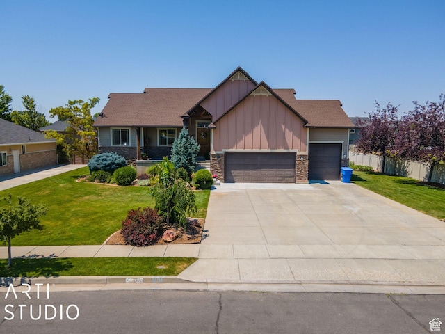 craftsman house featuring a garage and a front yard