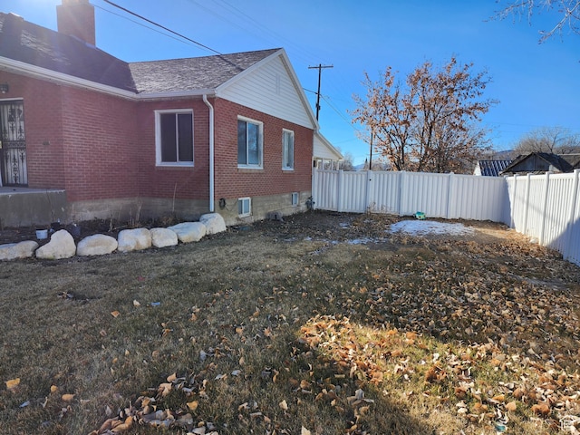 view of home's exterior with a yard