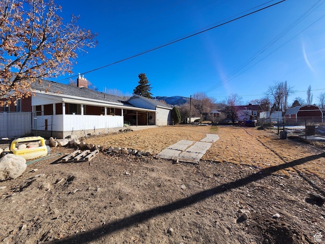 view of side of property featuring a sunroom