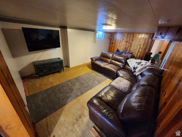 living room with wood walls