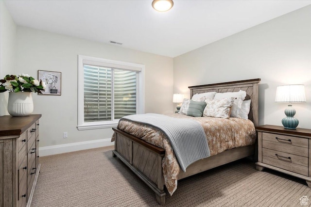 bedroom with light colored carpet