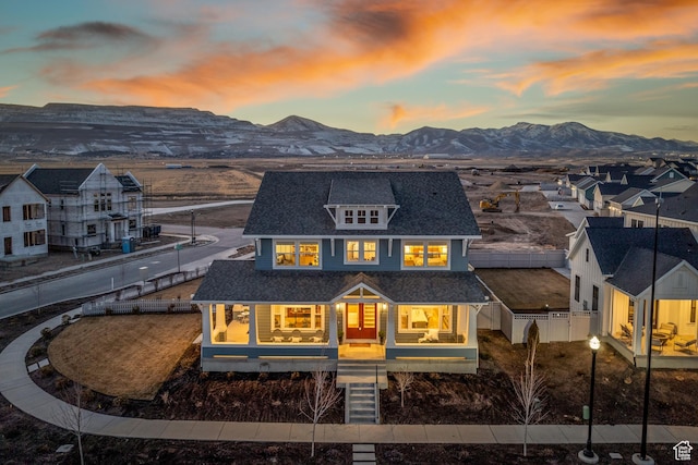 back house at dusk with a mountain view