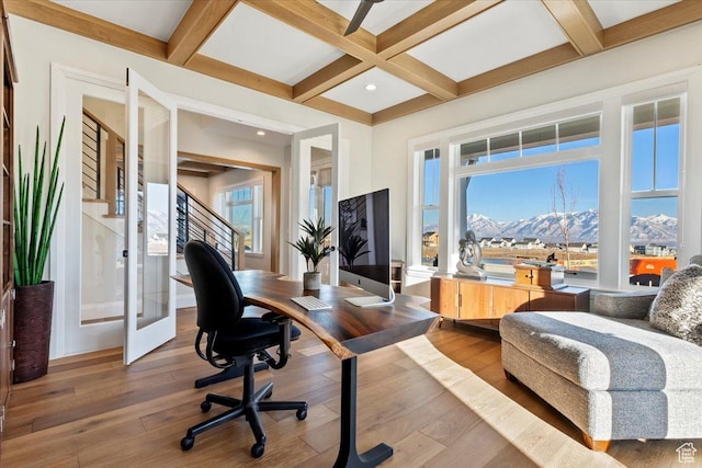 office featuring coffered ceiling, wood-type flooring, and beamed ceiling