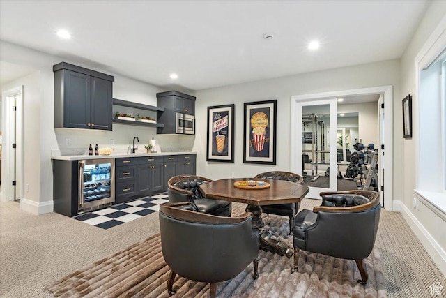 interior space with wine cooler and indoor wet bar