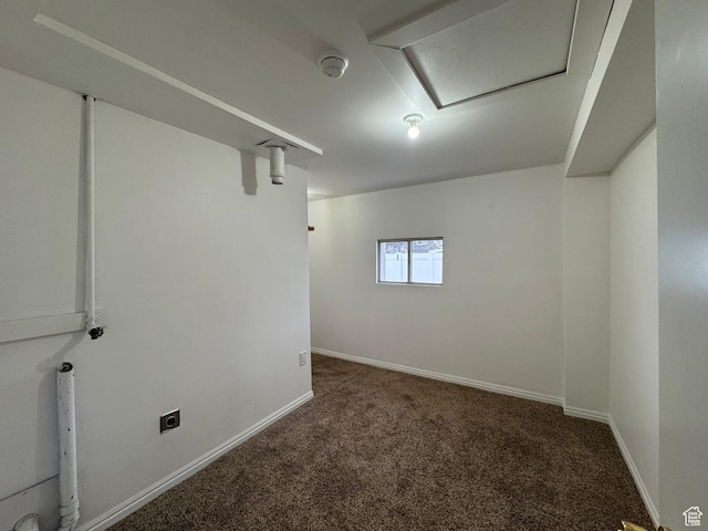 basement with dark carpet