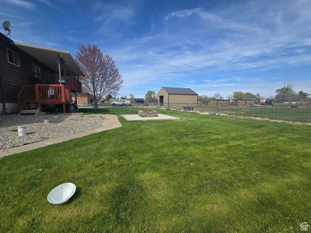 4556 W 4950 S, Hooper, UT 84315 - view of yard with an outdoor fire pit, a deck, and fence
