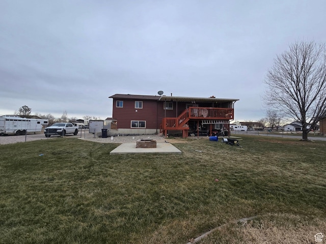 4556 W 4950 S, Hooper, UT 84315 - back of property featuring a patio area, an outdoor fire pit, a lawn, fence, and a wooden deck
