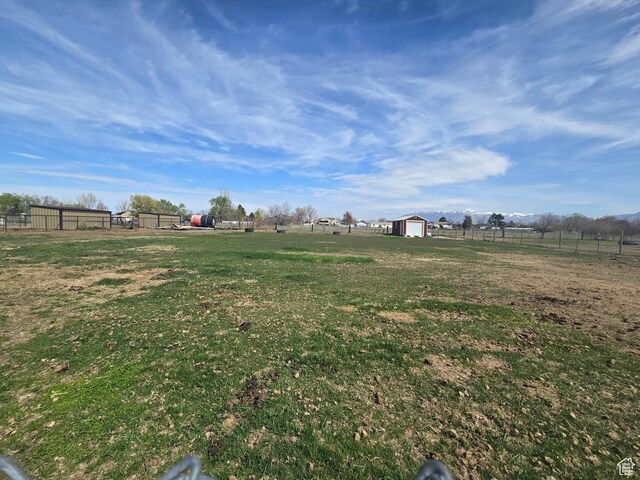 4556 W 4950 S, Hooper, UT 84315 - view of yard featuring a storage shed, fence, an outdoor structure, and a rural view