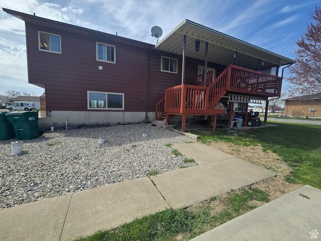 4556 W 4950 S, Hooper, UT 84315 - back of house featuring a deck and a lawn