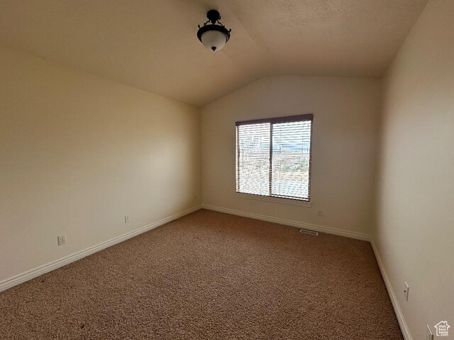 6751 S Sienna Park Ln, Midvale, UT 84047 - unfurnished room featuring vaulted ceiling and carpet