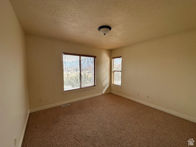 6751 S Sienna Park Ln, Midvale, UT 84047 - carpeted spare room featuring a textured ceiling