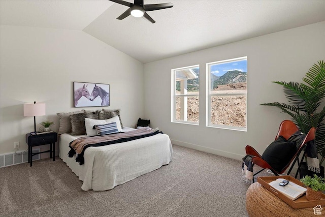 bedroom with ceiling fan, lofted ceiling, carpet flooring, and baseboards