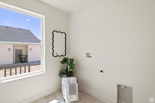 washroom featuring laundry area, light tile patterned floors, electric dryer hookup, washer hookup, and baseboards