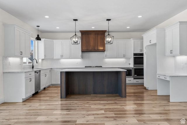 1002 W Temple Rim Ln, Payson, UT 84651 - kitchen with white cabinetry, a center island, sink, and pendant lighting