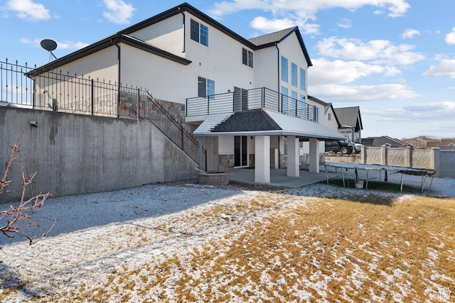 1002 W Temple Rim Ln, Payson, UT 84651 - back of property featuring a trampoline and a patio