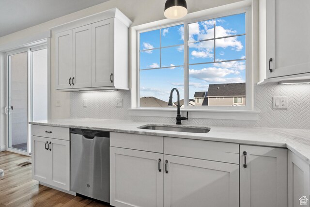 1002 W Temple Rim Ln, Payson, UT 84651 - kitchen with sink, wood-type flooring, stainless steel dishwasher, light stone countertops, and white cabinets