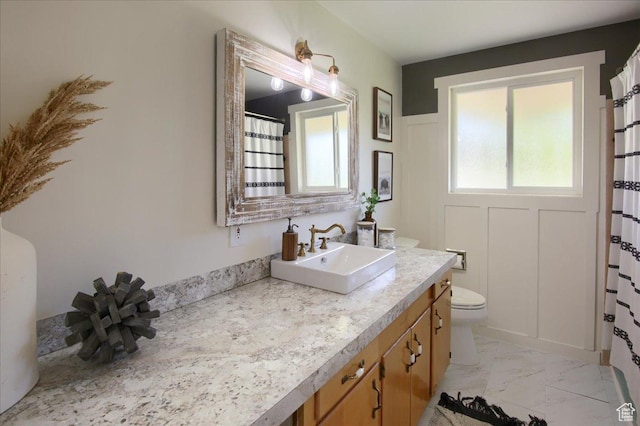 3095 N 275 E, North Ogden, UT 84414 - full bathroom featuring a shower with curtain, toilet, marble finish floor, and vanity