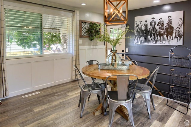 3095 N 275 E, North Ogden, UT 84414 - dining area with wood finished floors, visible vents, recessed lighting, wainscoting, and a decorative wall