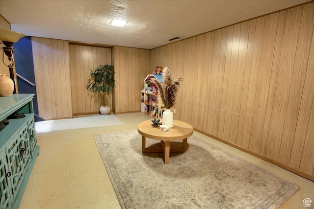 3095 N 275 E, North Ogden, UT 84414 - sitting room with wood walls, a textured ceiling, and baseboards