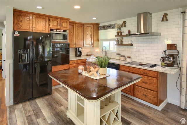 3095 N 275 E, North Ogden, UT 84414 - kitchen featuring open shelves, black appliances, wood finished floors, and wall chimney range hood