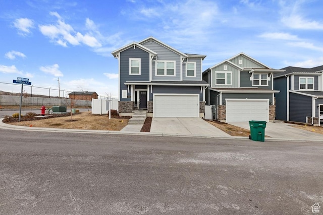 view of front of house with central AC unit, a garage, board and batten siding, fence, and concrete driveway