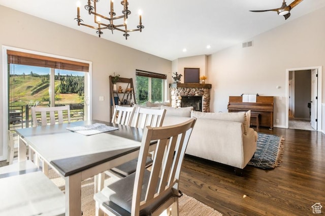 3942 View Pointe Dr, Park City, UT 84098 - dining room with vaulted ceiling, a chandelier, a fireplace, and dark hardwood / wood-style flooring