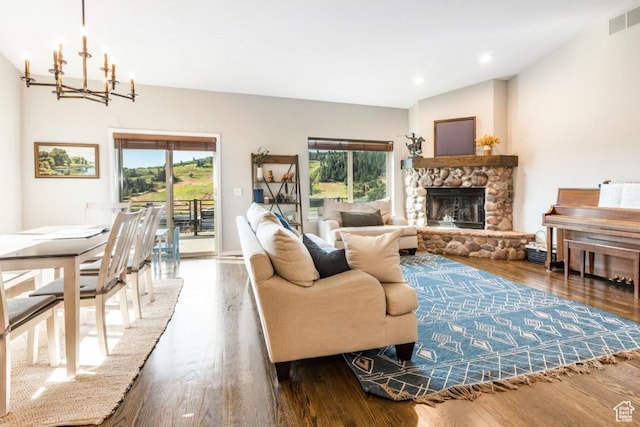 3942 View Pointe Dr, Park City, UT 84098 - living room featuring lofted ceiling, a fireplace, dark wood-type flooring, and a chandelier
