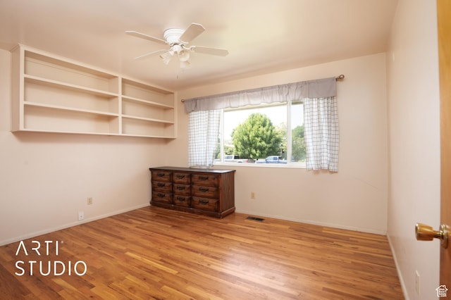 empty room featuring ceiling fan and light hardwood / wood-style floors