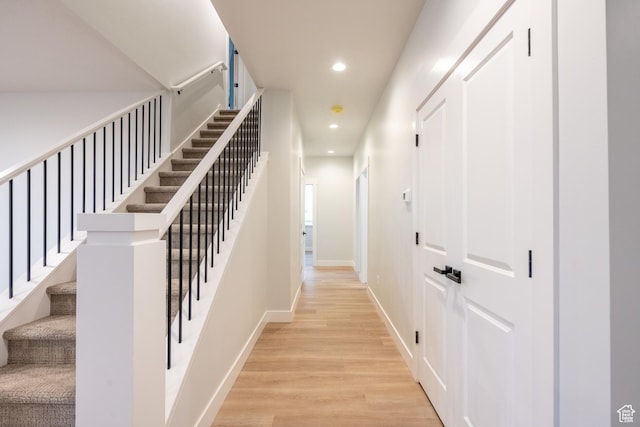 corridor with wood-type flooring