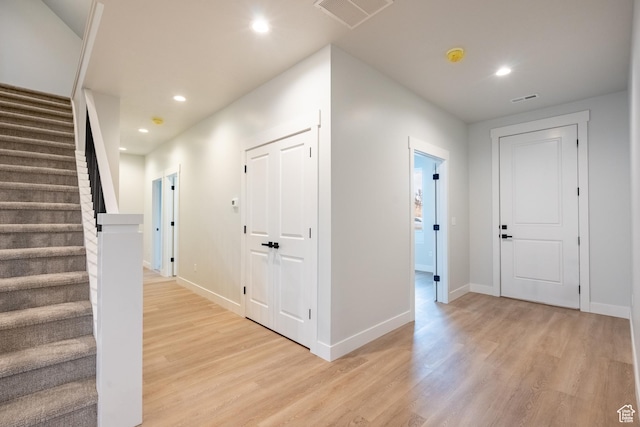 hallway with light wood-type flooring