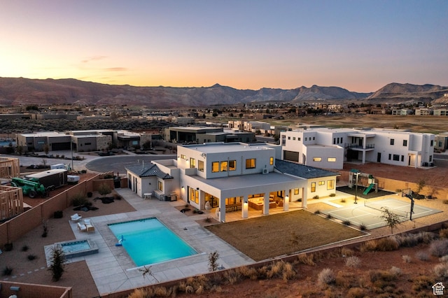 4862 N Sand Cove Cir, St George, UT 84770 - back house at dusk with a mountain view and a patio