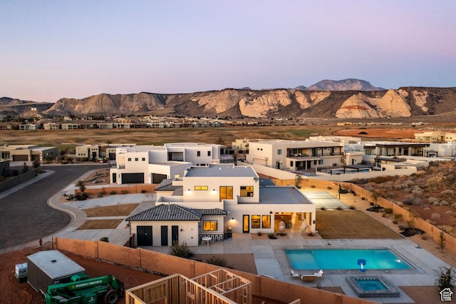 4862 N Sand Cove Cir, St George, UT 84770 - back house at dusk featuring a mountain view