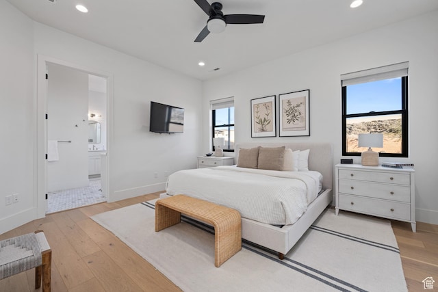 4862 N Sand Cove Cir, St George, UT 84770 - bedroom featuring ensuite bathroom, ceiling fan, and light hardwood / wood-style flooring