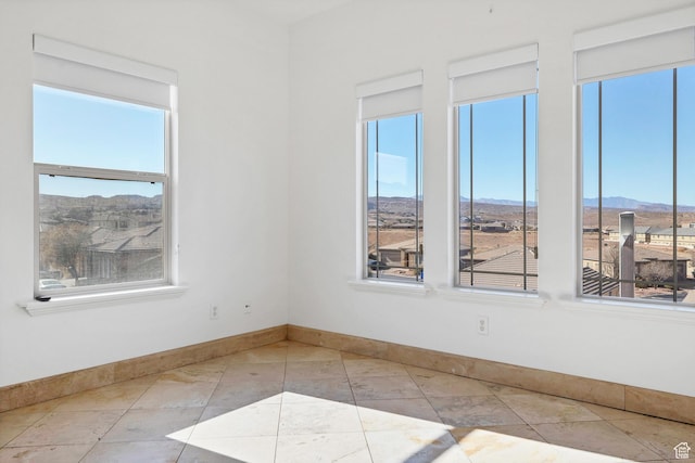2261 S Tonaquint Dr Unit 8, St George, UT 84770 - tiled empty room featuring a mountain view