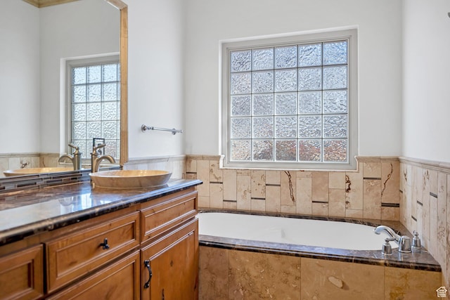 2261 S Tonaquint Dr Unit 8, St George, UT 84770 - bathroom with vanity and tiled bath