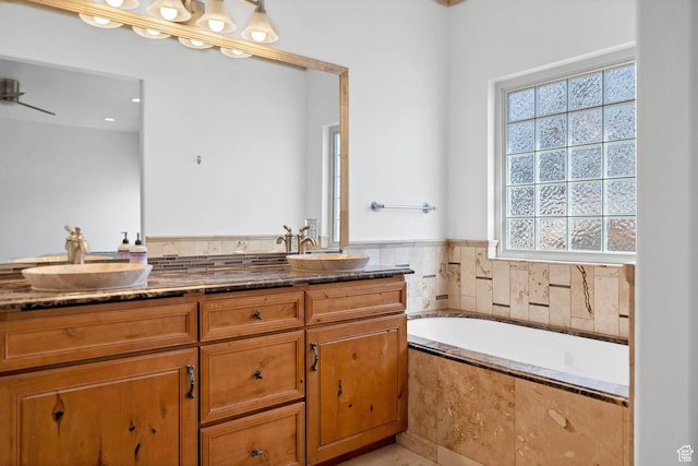 2261 S Tonaquint Dr Unit 8, St George, UT 84770 - bathroom with vanity and tiled tub