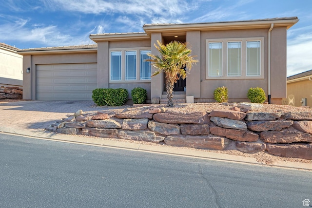 view of front of property with a garage