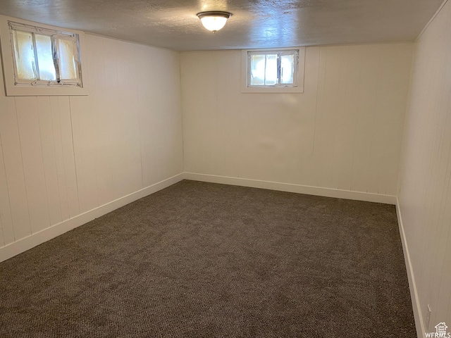 230 N 3rd St, Tooele, UT 84074 - basement featuring a textured ceiling and dark colored carpet